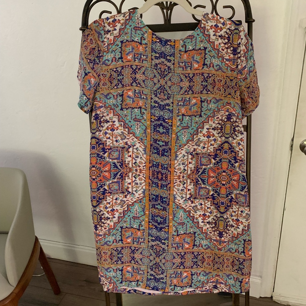 Never worn Beautiful and unique short sleeves mini dress.